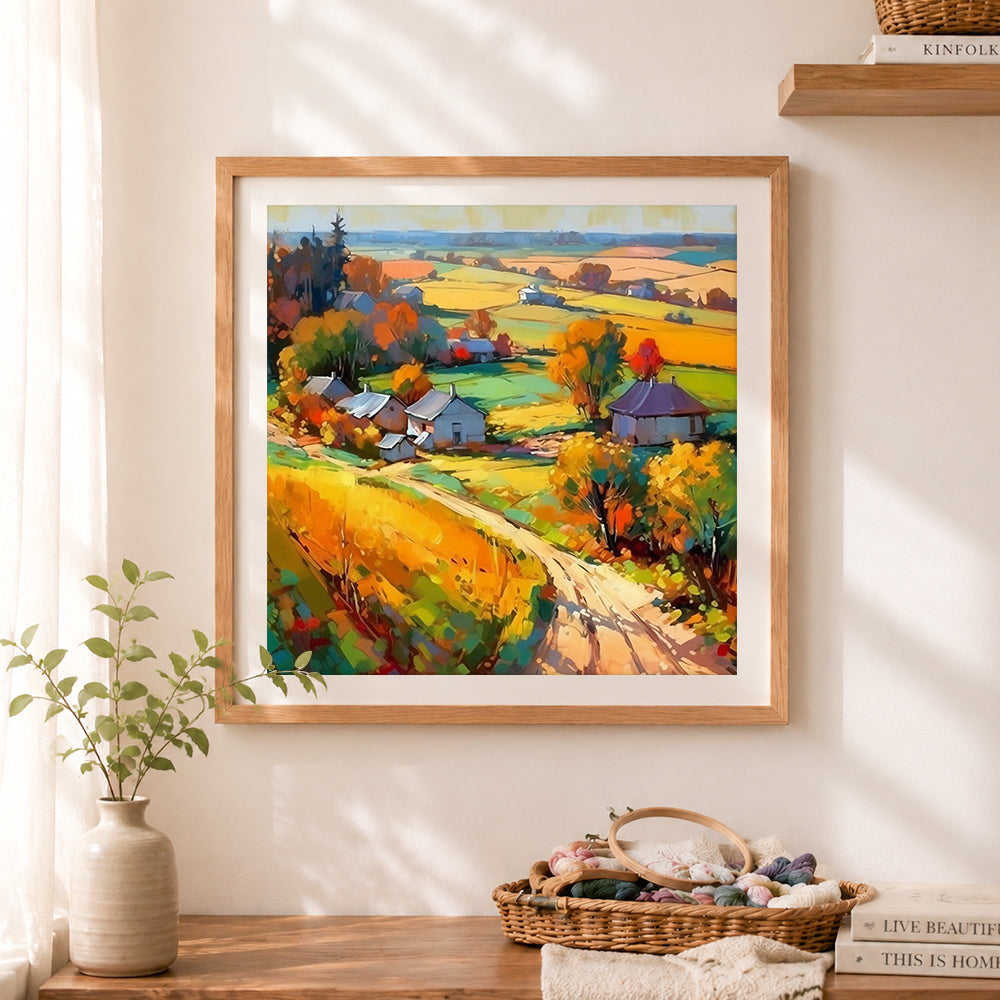 Finished rolling autumn hills village cross stitch artwork displayed as home decor