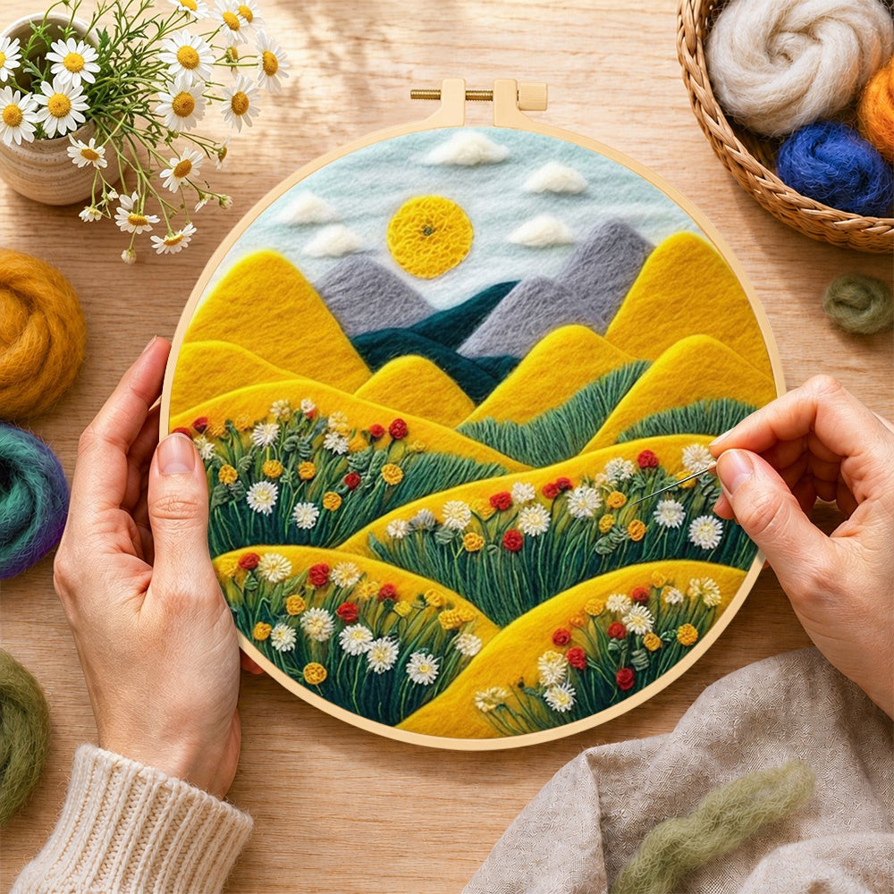 Creating the rolling golden hills and daisies wool painting by hand with a felting needle