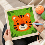 Creating handmade round and cuddly tiger face punch needle artwork
