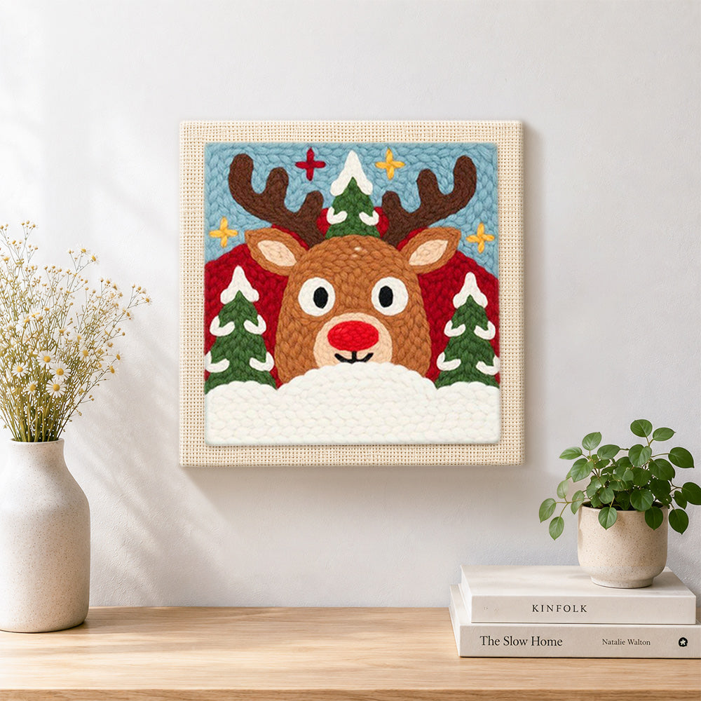 Finished rudolph reindeer face artwork displayed on a wall