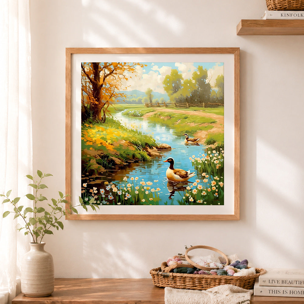 Finished rural stream and ducks cross stitch artwork displayed as home decor