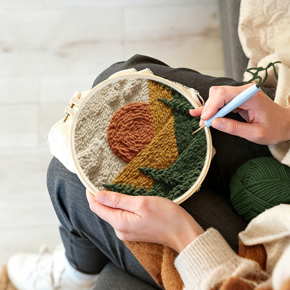 Creating handmade rustic pine forest sunset punch needle artwork