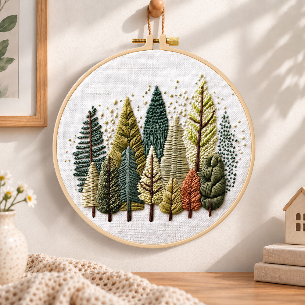 Rustic pine tree grove embroidery hoop wall art displayed as warm and cozy handmade home decor