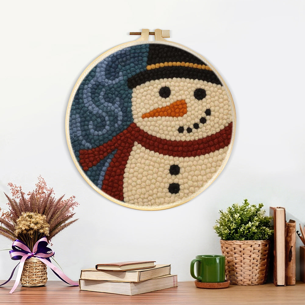 Finished rustic snowman portrait artwork displayed on a wall