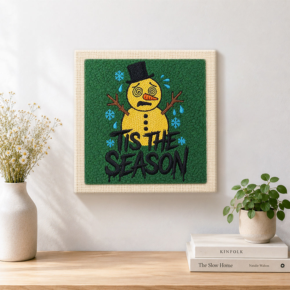 Finished sad melting snowman art artwork displayed on a wall