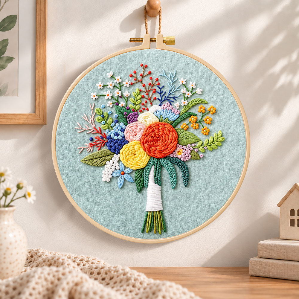 Sage green floral bouquet embroidery hoop wall art displayed as warm and cozy handmade home decor