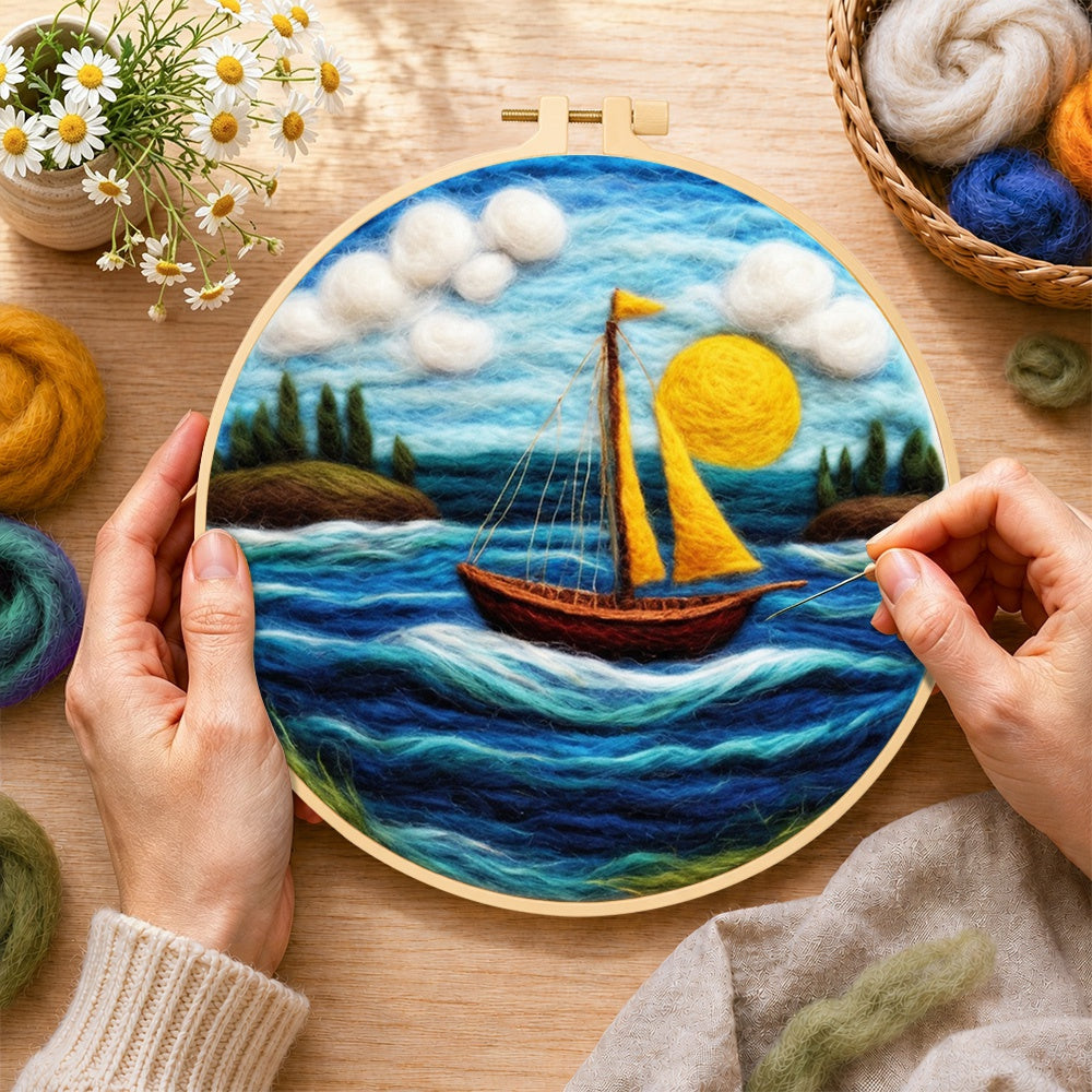 Creating the sailing into the sun wool painting by hand with a felting needle