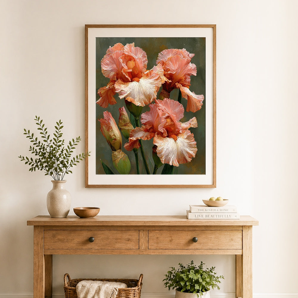 Finished salmon pink iris flowers cross stitch artwork displayed as home decor