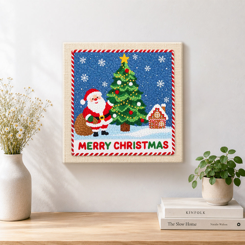 Finished santa beside christmas tree artwork displayed on a wall