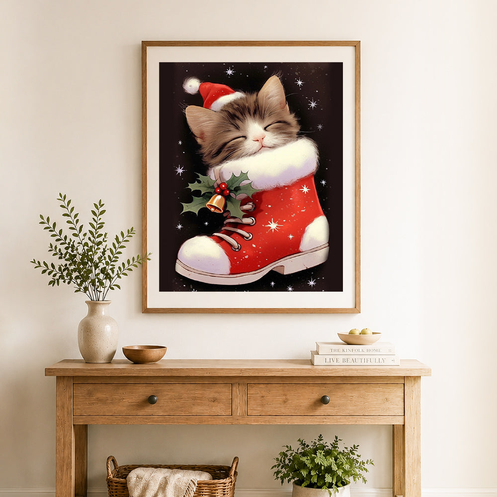 Finished santa boot kitty cross stitch artwork displayed as home decor