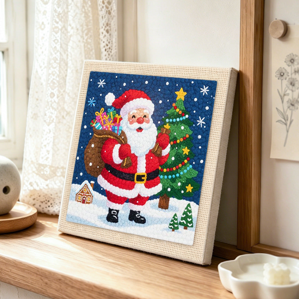 Santa claus with gift sack punch needle artwork displayed on a table