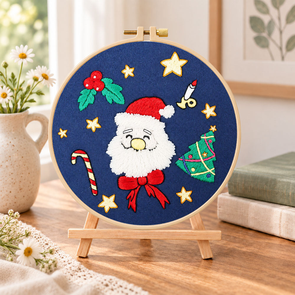 Santa face design embroidery kit finished hoop displayed on a wooden stand as cozy tabletop decor
