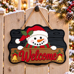 Santa hat snowman paint by numbers door hanger on a garden gate