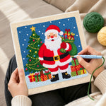Creating handmade santa holding gift sack punch needle artwork