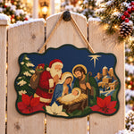 Santa visits nativity paint by numbers door hanger on a garden gate