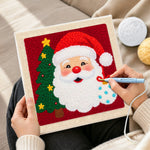 Creating handmade santa with christmas tree punch needle artwork
