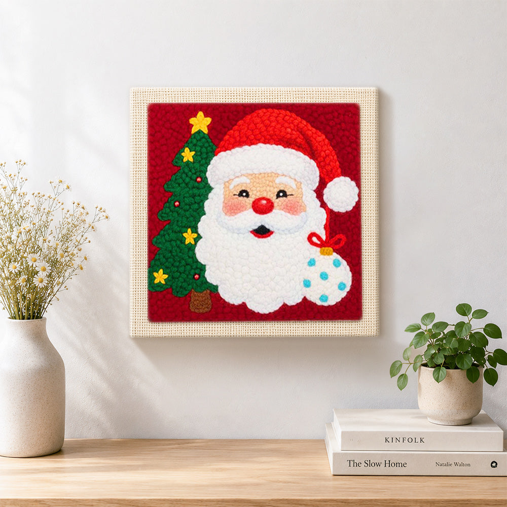 Finished santa with christmas tree artwork displayed on a wall