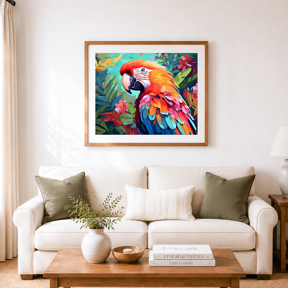 Finished scarlet macaw in tropical foliage cross stitch artwork displayed as home decor