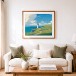 Finished scenic coastal lighthouse vista cross stitch artwork displayed as home decor