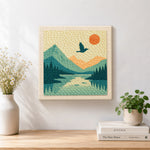 Finished scenic mountain landscape artwork displayed on a wall