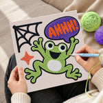Creating handmade screaming halloween frog punch needle artwork