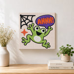 Finished screaming halloween frog artwork displayed on a wall