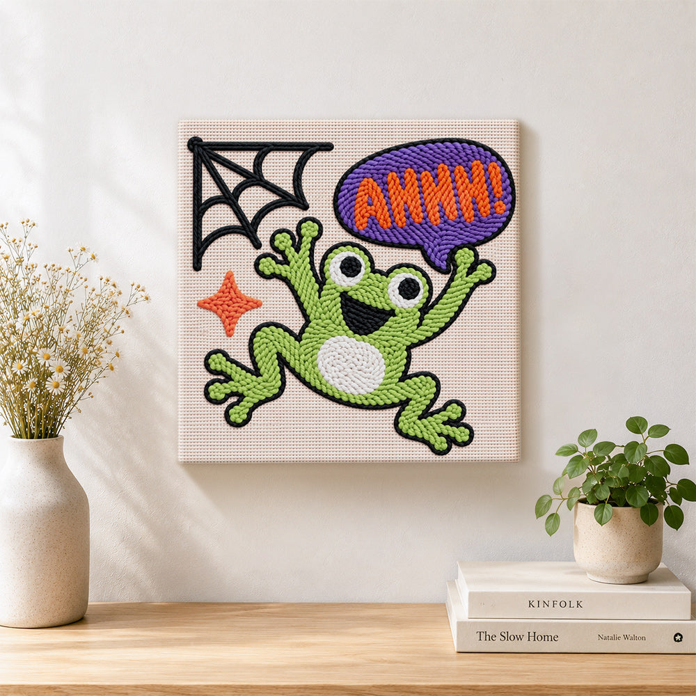 Finished screaming halloween frog artwork displayed on a wall