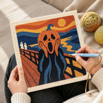 Creating handmade screaming pumpkin art punch needle artwork