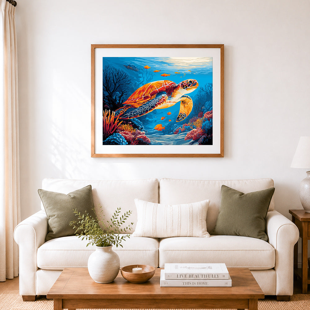 Finished sea turtle in coral reef cross stitch artwork displayed as home decor