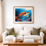 Finished sea turtle in coral reef cross stitch artwork displayed as home decor