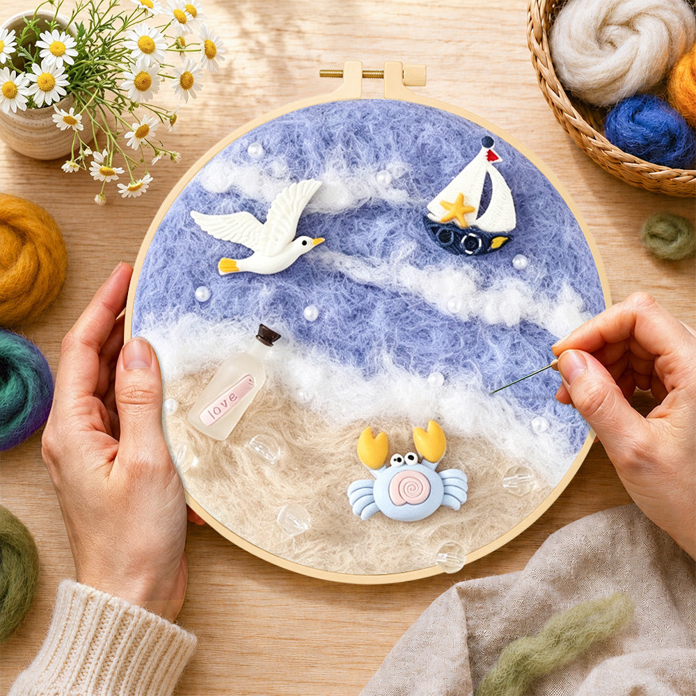 Creating the seagull, crab and sailboat wool painting by hand with a felting needle