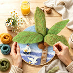 Creating the seagull, palm tree and sailboat wool painting by hand with a felting needle