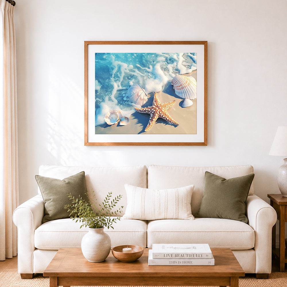 Finished seashells and starfish in ocean foam cross stitch artwork displayed as home decor