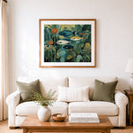 Finished serene aquarium fish and botanical flowers cross stitch artwork displayed as home decor