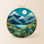 Serene blue mountain with textured floral foliage needle felting kit for beginners with a round wooden frame