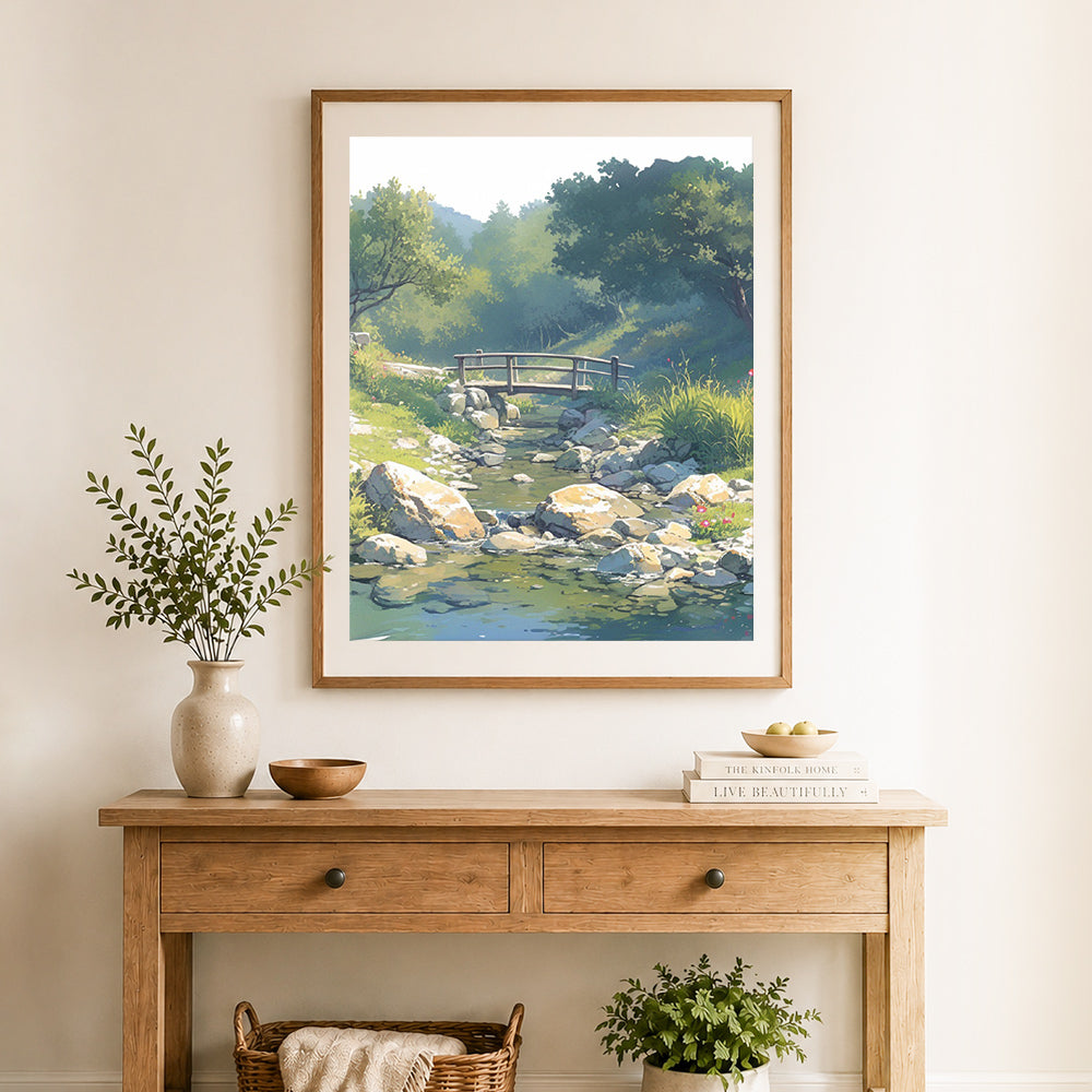 Finished serene creek bridge cross stitch artwork displayed as home decor