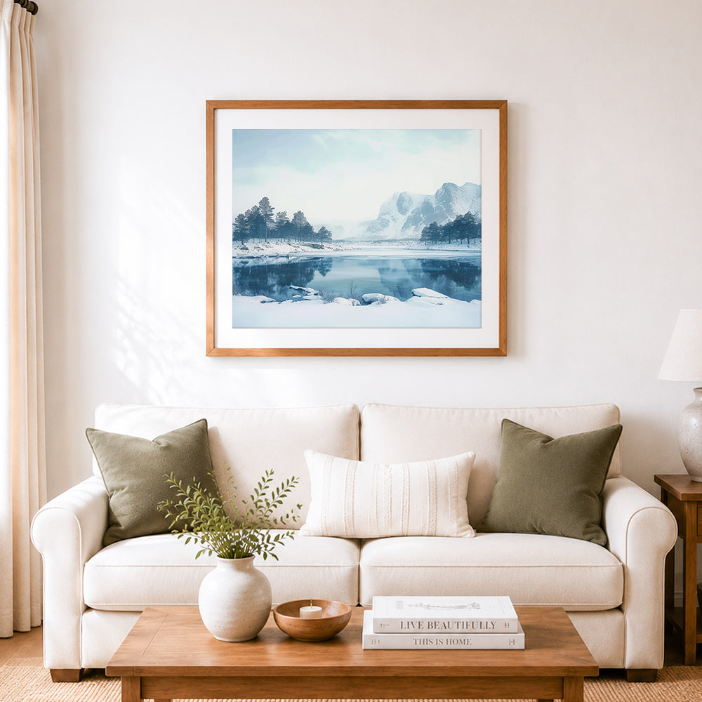 Finished serene frozen mountain lake cross stitch artwork displayed as home decor