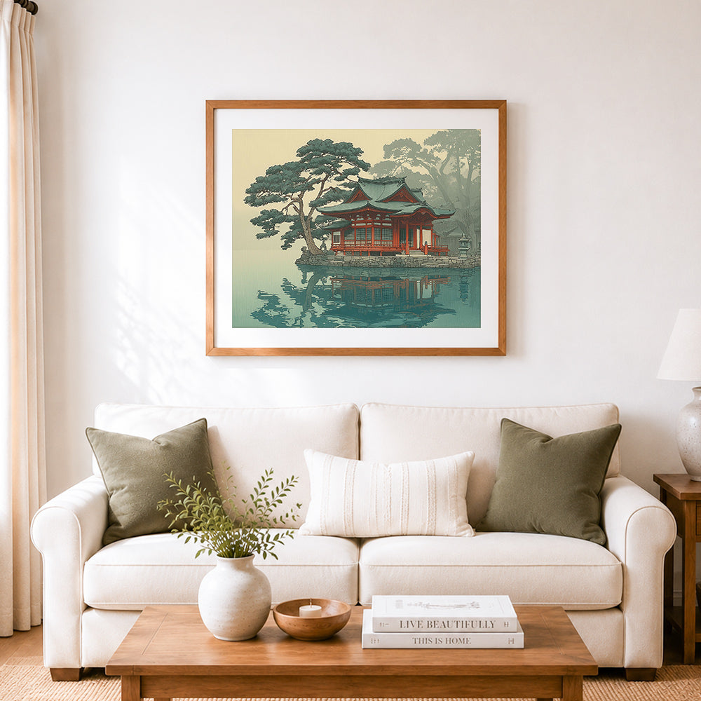 Finished serene lakeside shrine cross stitch artwork displayed as home decor