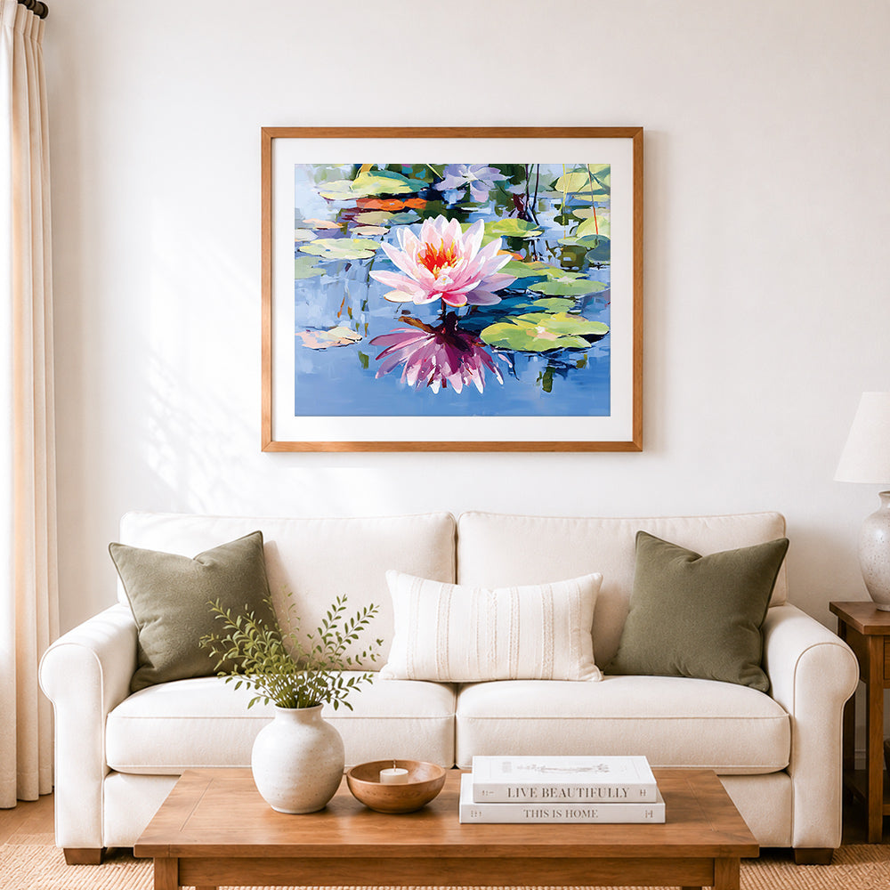 Finished serene pink water lily cross stitch artwork displayed as home decor