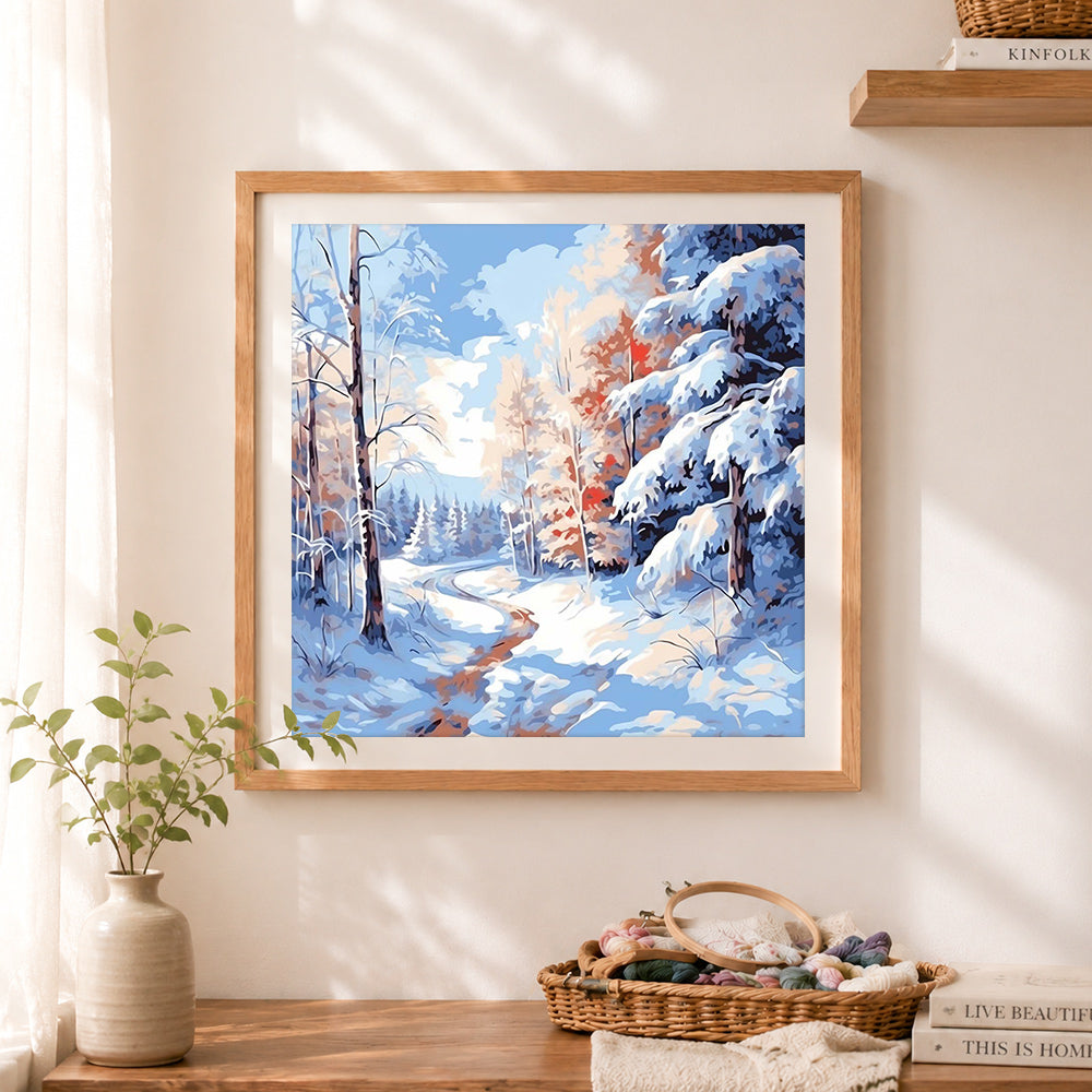Finished serene winter woodland trail cross stitch artwork displayed as home decor