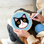 Creating handmade serious cat punch needle artwork