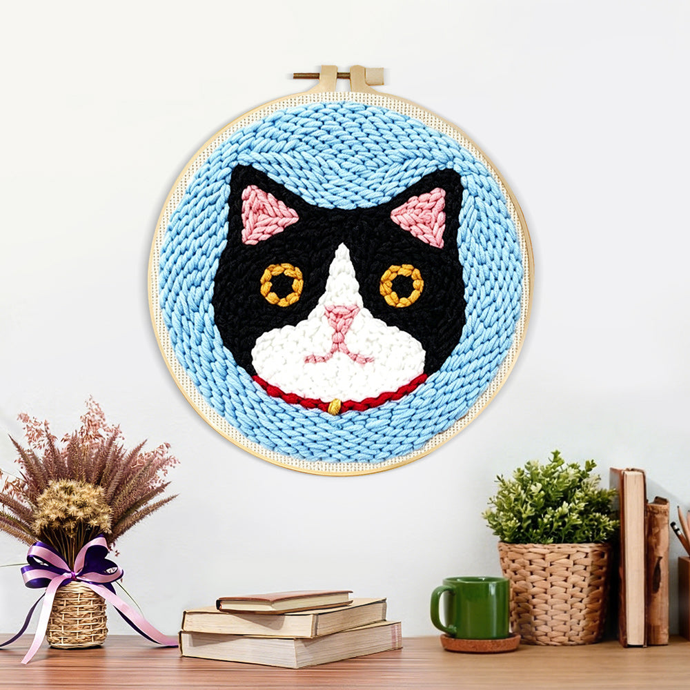 Finished serious cat artwork displayed on a wall
