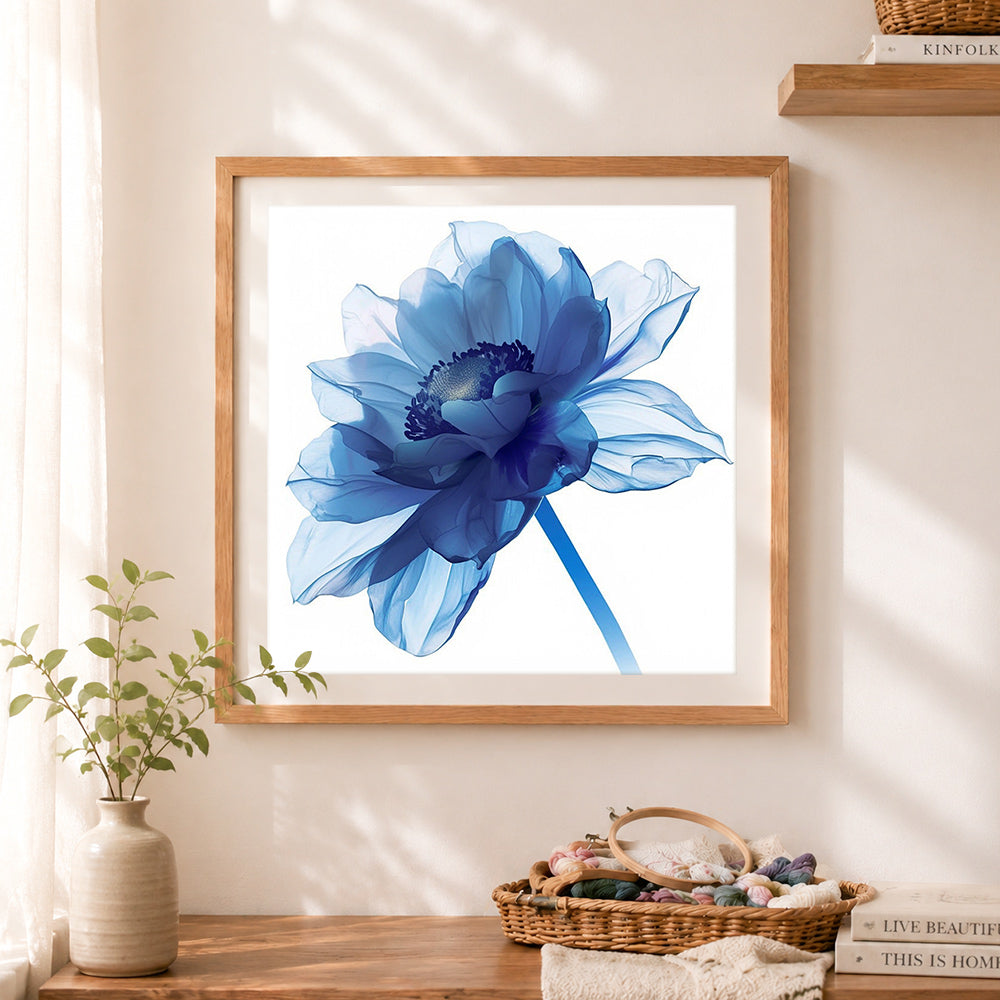 Finished sheer blue anemone cross stitch artwork displayed as home decor