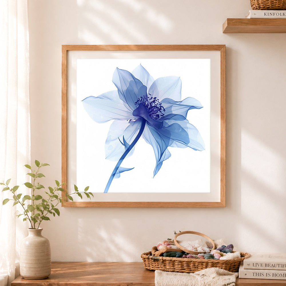 Finished sheer blue flower cross stitch artwork displayed as home decor