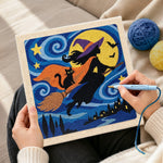 Creating handmade silhouette witch night flight punch needle artwork