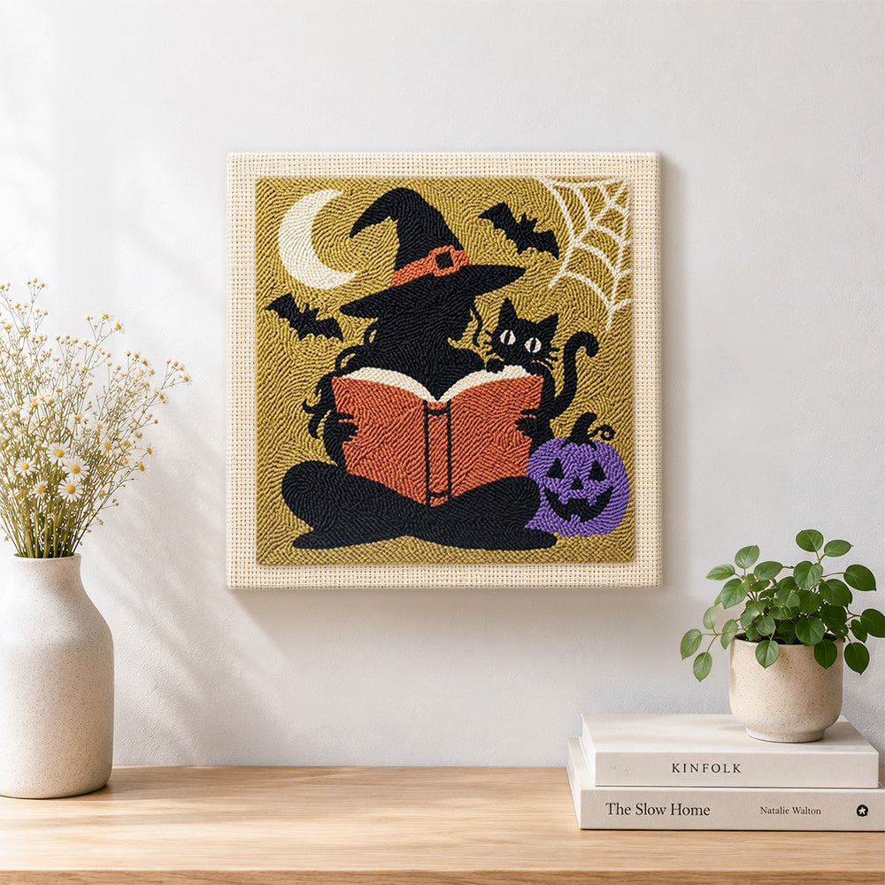 Finished silhouette witch reading book artwork displayed on a wall
