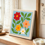 Simple and colorful wildflowers punch needle artwork displayed on a table