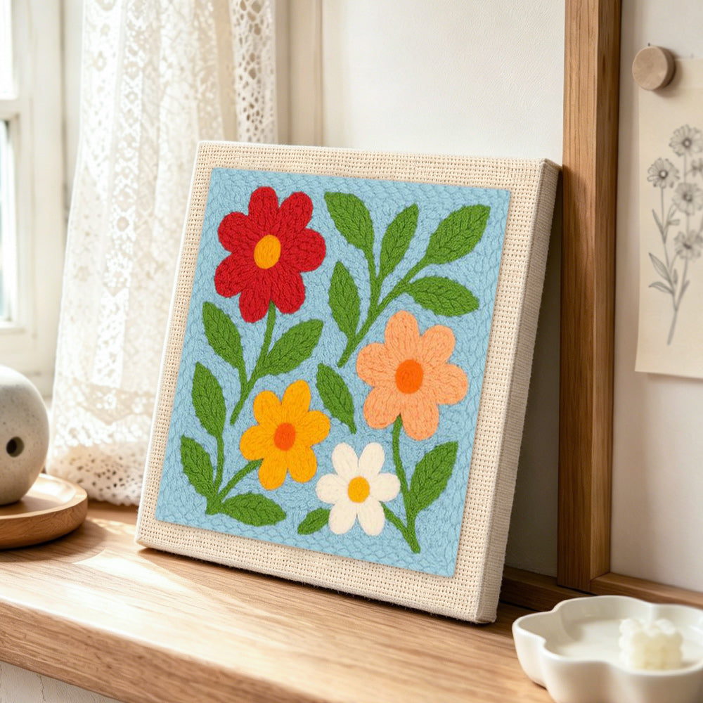 Simple and colorful wildflowers punch needle artwork displayed on a table