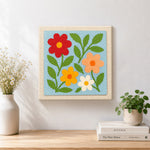Finished simple and colorful wildflowers artwork displayed on a wall