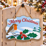 Simple robin christmas paint by numbers door hanger on a garden gate